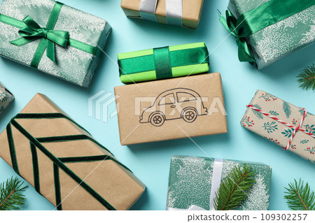Christmas gifts with a car, top view. Christmas gifts with a car, top view. 109302257