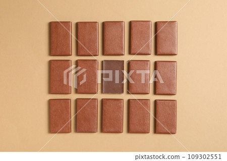 Brown chocolate bars on a light background 109302551