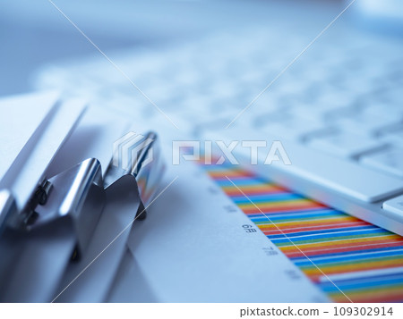 Graphs, documents and a keyboard on the table Graphs, documents and a keyboard on the table 109302914