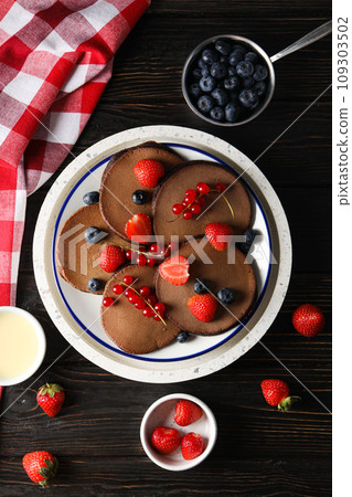 Chocolate pancakes, tasty breakfast, concept of delicious food Chocolate pancakes, tasty breakfast, concept of delicious food 109303502