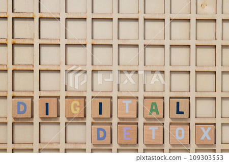 The inscription "digital detoxification" with wooden cubes The inscription "digital detoxification" with wooden cubes 109303553