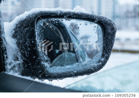 car covered with ice after snowstorm car covered with ice after snowstorm 109305256