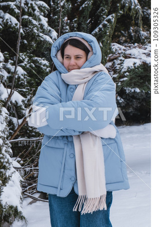portrait of the woman get frozen outdoors at cold winter day portrait of the woman get frozen outdoors at cold winter day 109305326