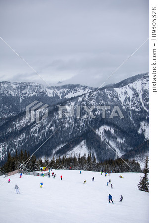 people skiers eating on the top of the slope people skiers eating on the top of the slope 109305328