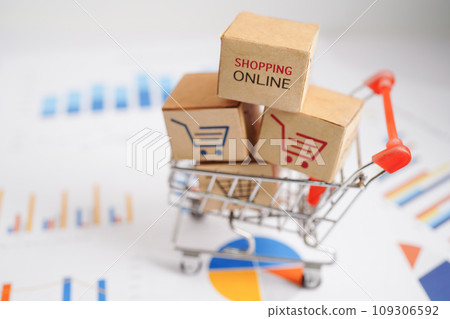 Online shopping, Shopping cart box on business graph, import export, finance commerce. Online shopping, Shopping cart box on business graph, import export, finance commerce. 109306592