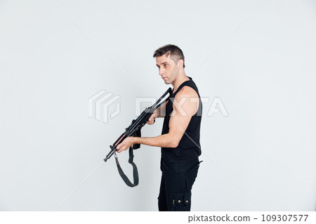 man 40 years old with military weapon man 40 years old with military weapon 109307577