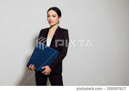 Business beautiful woman in brown business suit in office 109307627