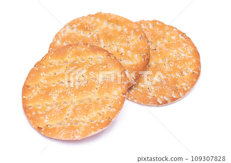 A Heap of Round Salt Crackers with Sesame Isolated on White Background A Heap of Round Salt Crackers with Sesame Isolated on White Background 109307828