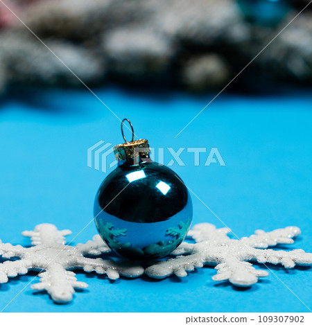 Blue christmas ball toy for christmas tree on blue background 109307902