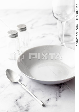 Set of soup plates and dinnerware on white marble background 109307944