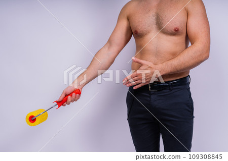 Cheerful young topless man hold paint roller isolated on grey background studio. Cheerful young topless man hold paint roller isolated on grey background studio. 109308845