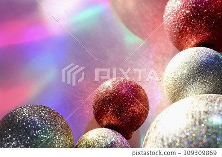christmas balls on a background of colored lights and bokeh. christmas balls on a background of colored lights and bokeh. 109309869