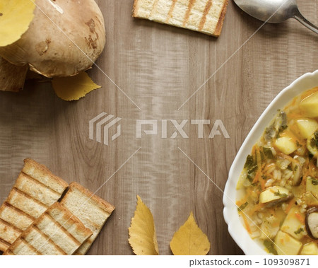 Mushroom soup in a white bowl on a beige background 109309871