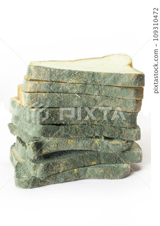 Green moldy bread isolated on a white background. 109310472