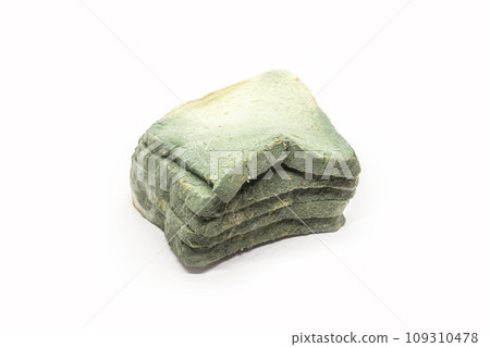 Wasted bread isolated on white. Biodegradable food waste concept. Selective focus 109310478
