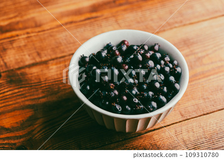 Ripe Purple Berries of Shadbush in Bowl 109310780