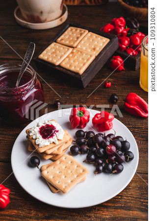 Crackers with Cream Cheese and Chili Pepper Jam Crackers with Cream Cheese and Chili Pepper Jam 109310804