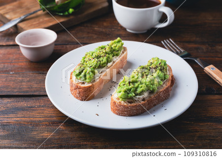 Toasts with avocado and cream cheese 109310816