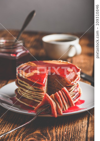 Stack of american pancakes with red berry jam Stack of american pancakes with red berry jam 109310846