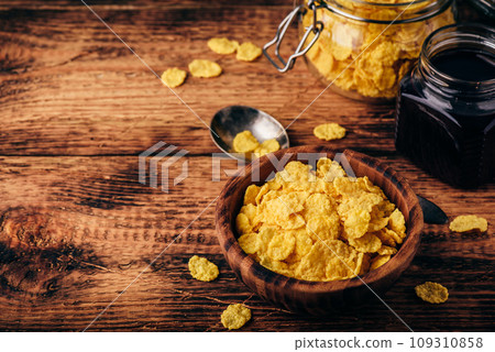 Breakfast with corn flakes, milk and jam 109310858