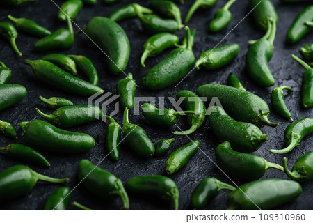 Ripe Jalapeno Peppers on Concrete Backdrop Ripe Jalapeno Peppers on Concrete Backdrop 109310960