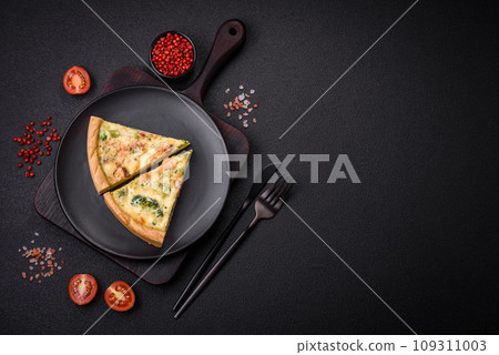 Delicious quiche with broccoli, cheese, chicken, spices and herbs 109311003