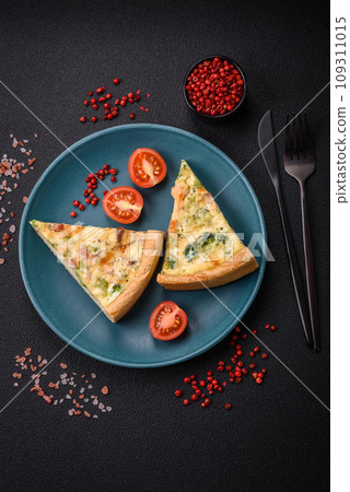 Delicious quiche with broccoli, cheese, chicken, spices and herbs Delicious quiche with broccoli, cheese, chicken, spices and herbs 109311015