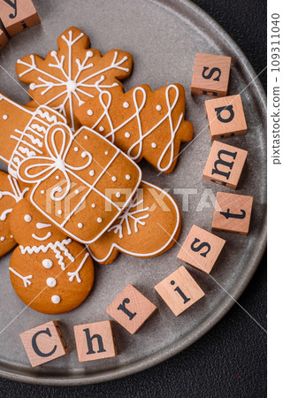 Beautiful Christmas composition with copy space with an inscription in wooden cubes Beautiful Christmas composition with copy space with an inscription in wooden cubes 109311040