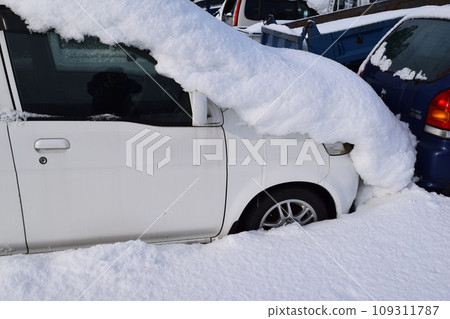 A car buried in heavy snow A car buried in heavy snow 109311787