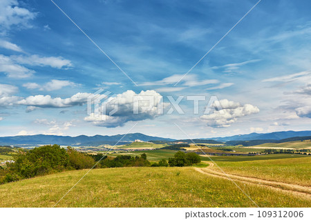 Slovakia summer landscape. Green summer fields, meadows, hills of Tatra mountains. Travel in vacations. Rural Road in Spis region, Slovakia. Spissky hrad national park 109312006