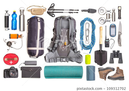 Set of tourist trekking items on white background. Top view of accessories for travel. 109312702