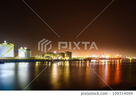 Misty Evening View of Rotterdam Port in the Glowing Night Lights 109314094