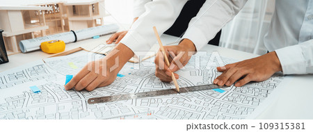 Worker, architect and engineer work on real estate construction project oratory 109315381