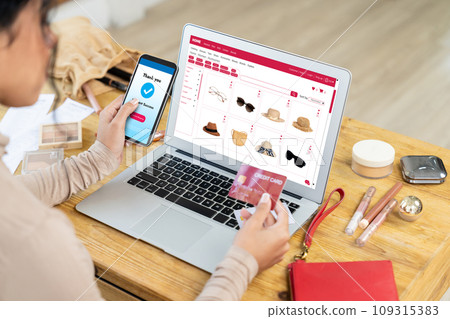Woman shopping online on internet marketplace browsing for crucial sale items Woman shopping online on internet marketplace browsing for crucial sale items 109315383
