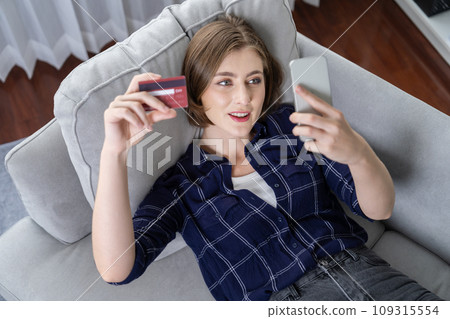Young happy woman buy product by online shopping with utmost security 109315554