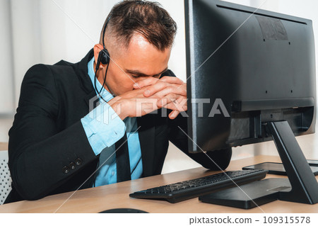 Business people wearing headset feel unhappy working in office Jivy 109315578