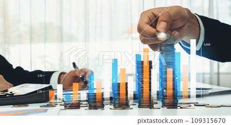 Coin stack with digital graphic indicator symbolize business investment. Shrewd Coin stack with digital graphic indicator symbolize business investment. Shrewd 109315670
