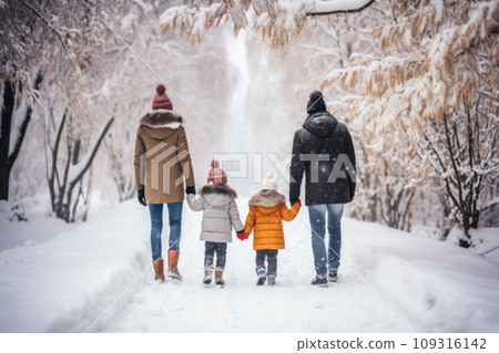 Happy family Father, mother and children are on winter walk in nature comeliness 109316142