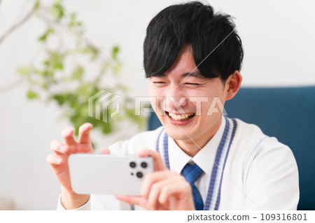 Young man wearing school uniform, student image 109316801