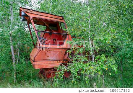Abandoned combine harvester in former mechanized yard of state farm in Chernobyl exclusion zone, Belarus Abandoned combine harvester in former mechanized yard of state farm in Chernobyl exclusion zone, Belarus 109317332