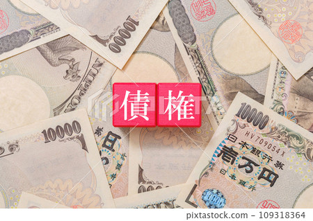 Debt letters written on red block Debt 10,000 yen bill 109318364