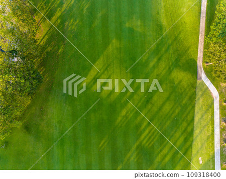 Aerial view of beautiful green golf field fairway and putting green, Top down image for sport background and travel nature background, Amazing green nature view Aerial view of beautiful green golf field fairway and putting green, Top down image for sport background and travel nature background, Amazing green nature view 109318400