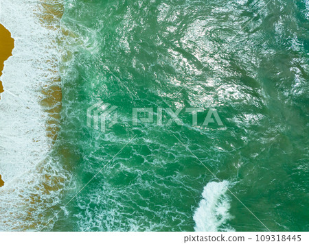 Beautiful waves sea surface in sunny day summer background, Amazing seascape, Top view beach sea background Beautiful waves sea surface in sunny day summer background, Amazing seascape, Top view beach sea background 109318445