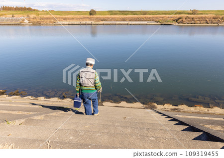 Senior man enjoying his hobby of fishing Senior man enjoying his hobby of fishing 109319455