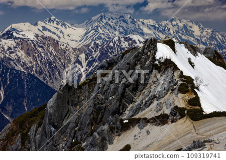 Tsurugi and Tateyama mountain range covered in remaining snow seen from Mt. Tsubaku in the Northern Alps Tsurugi and Tateyama mountain range covered in remaining snow seen from Mt. Tsubaku in the Northern Alps 109319741