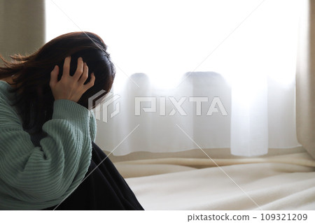 woman covering her head 109321209