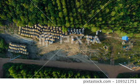 Wooden Coils of Electrical wires at outdoor construction site. High voltage cable roll. Wooden Coils of Electrical wires at outdoor construction site. High voltage cable roll. 109321751