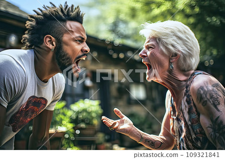 Old tattooed short-haired white woman and young black man arguing loudly with open mouths Old tattooed short-haired white woman and young black man arguing loudly with open mouths 109321841