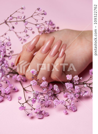 Female hands with beautiful manicure on pink background 109322762