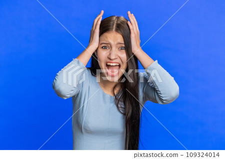 Irritated angry Caucasian woman screams from stress tension problems, shock, rage, nervous, quarrel 109324014